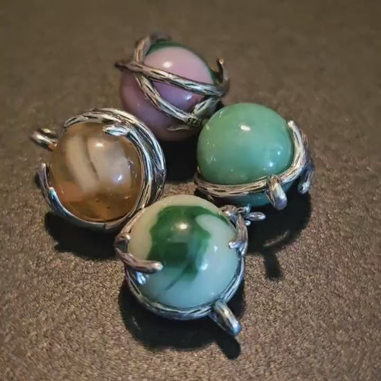 Uranium Glass Pendants in new Sterling Silver with a vintage 14 to 16 mm round Uranium Glass marbles that glow under black / UV light