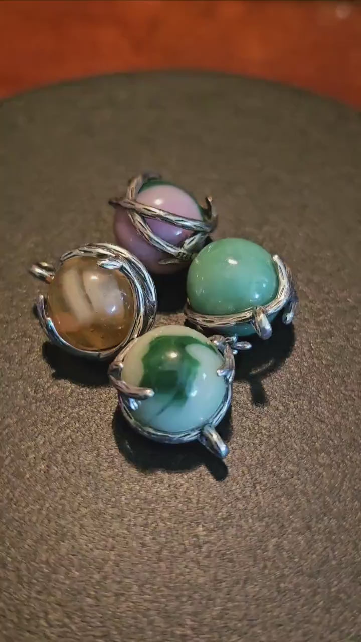 Uranium Glass Pendants in new Sterling Silver with a vintage 14 to 16 mm round Uranium Glass marbles that glow under black / UV light