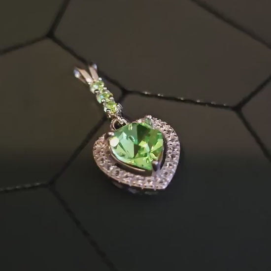 Uranium Glass Pendant in new Sterling Silver setting with 4 vintage Heart and Round cut Uranium Glass stones that glow under black/UV light