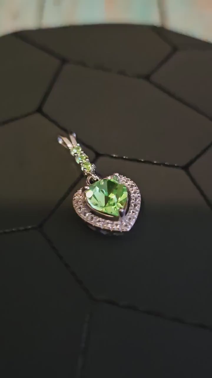Uranium Glass Pendant in new Sterling Silver setting with 4 vintage Heart and Round cut Uranium Glass stones that glow under black/UV light