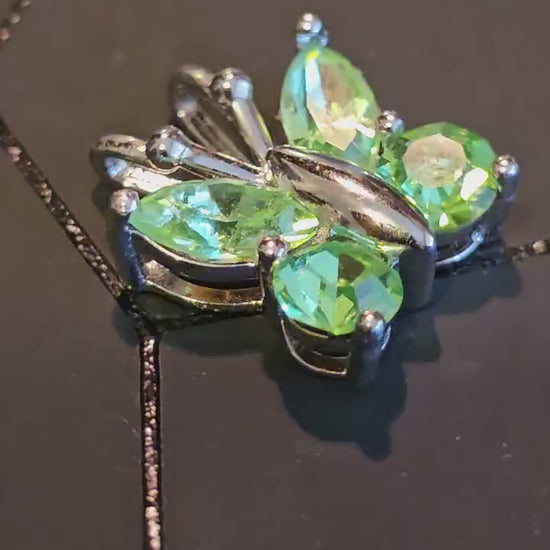 Uranium Glass Pendant in new Sterling Silver Butterfly design with Vintage Uranium Glass stones that glow under black / UV light