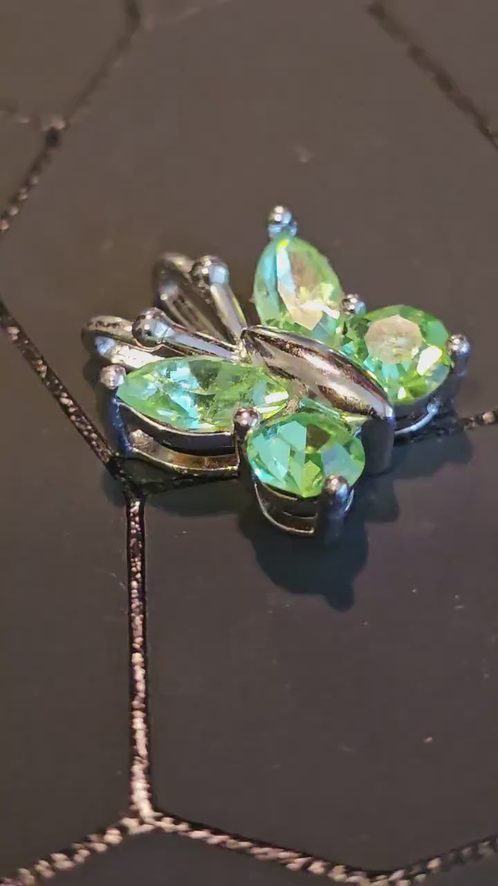 Uranium Glass Pendant in new Sterling Silver Butterfly design with Vintage Uranium Glass stones that glow under black / UV light