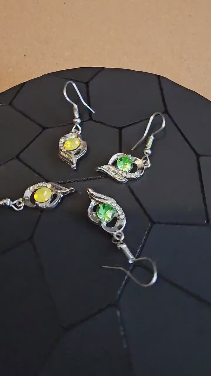 Uranium Glass Earrings new Silver plateing with Vintage Round cut 5 mm Uranium Glass stones Green or Yellow that glow under black/UV light