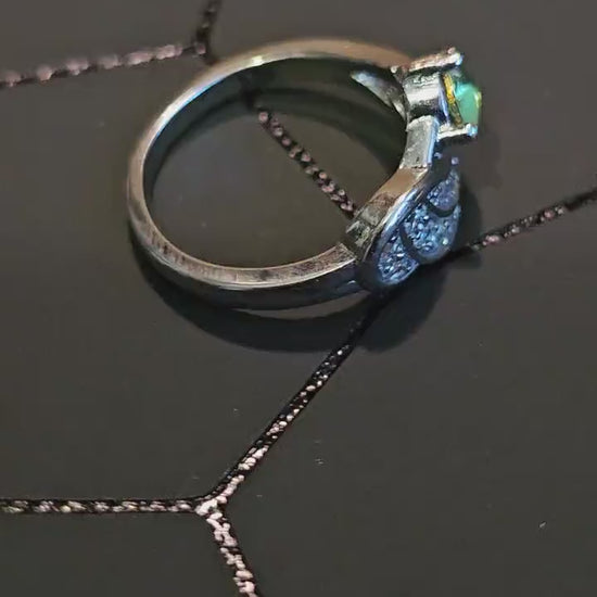 Uranium Glass Round cut Ring in size 6.  New Silver plated with a vintage 5mm Uranium glass stone that glows under black/UV light