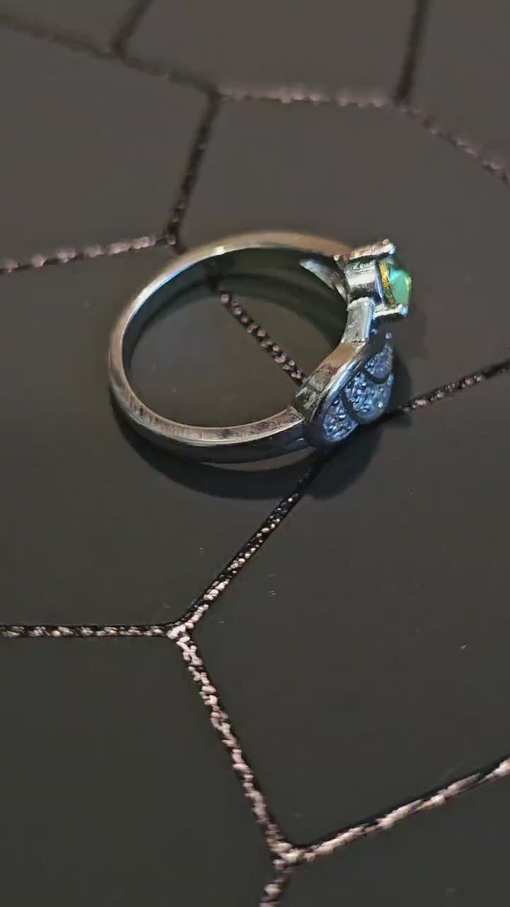 Uranium Glass Round cut Ring in size 6.  New Silver plated with a vintage 5mm Uranium glass stone that glows under black/UV light