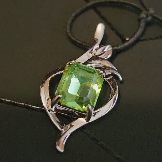 Uranium Glass Pendant in new Sterling Silver with a vintage Emerald cut Uranium Glass stone glows under black / UV light