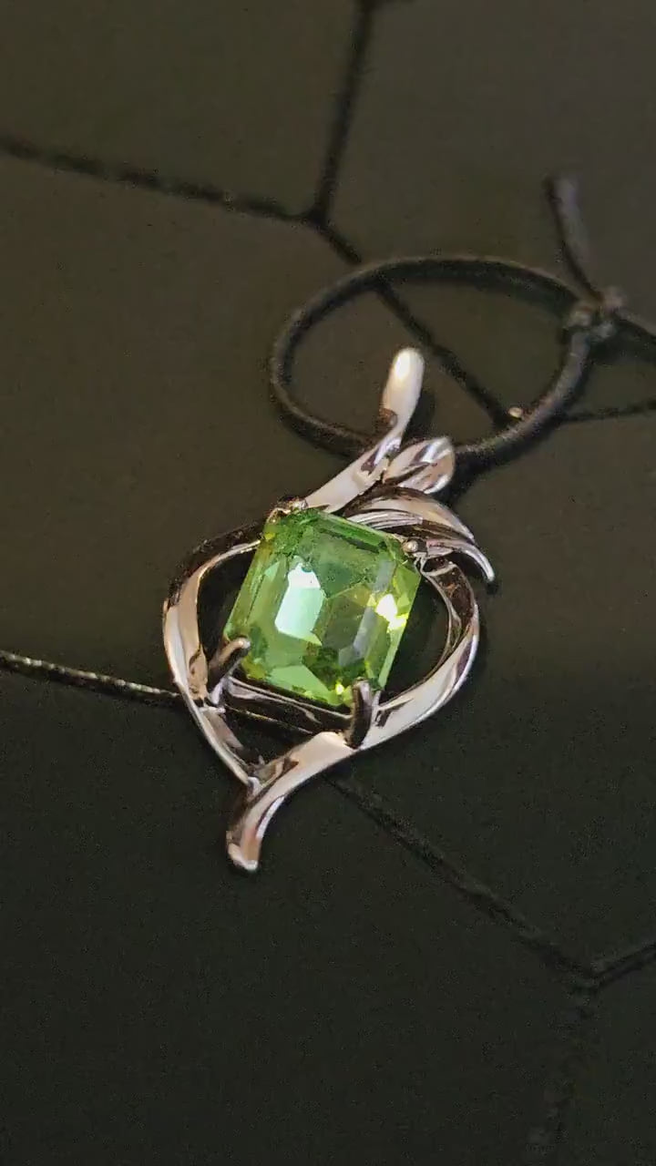 Uranium Glass Pendant in new Sterling Silver with a vintage Emerald cut Uranium Glass stone glows under black / UV light