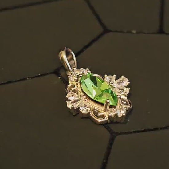 Uranium Glass Pendant in new Sterling Silver Fleur De Lis with a vintage 12x6 mm Marquise cut Uranium Glass that glows under black/UV light